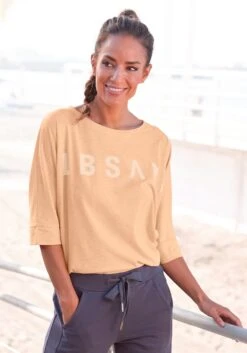 Buffalo Midi-jurk Van Zacht Ribmateriaal 37 Buffalo Midi-jurk Van Zacht Ribmateriaal -TrendyTijd Verkoop elbsand shirt met 3 4 mouwen iduna met logoprint oranje 1